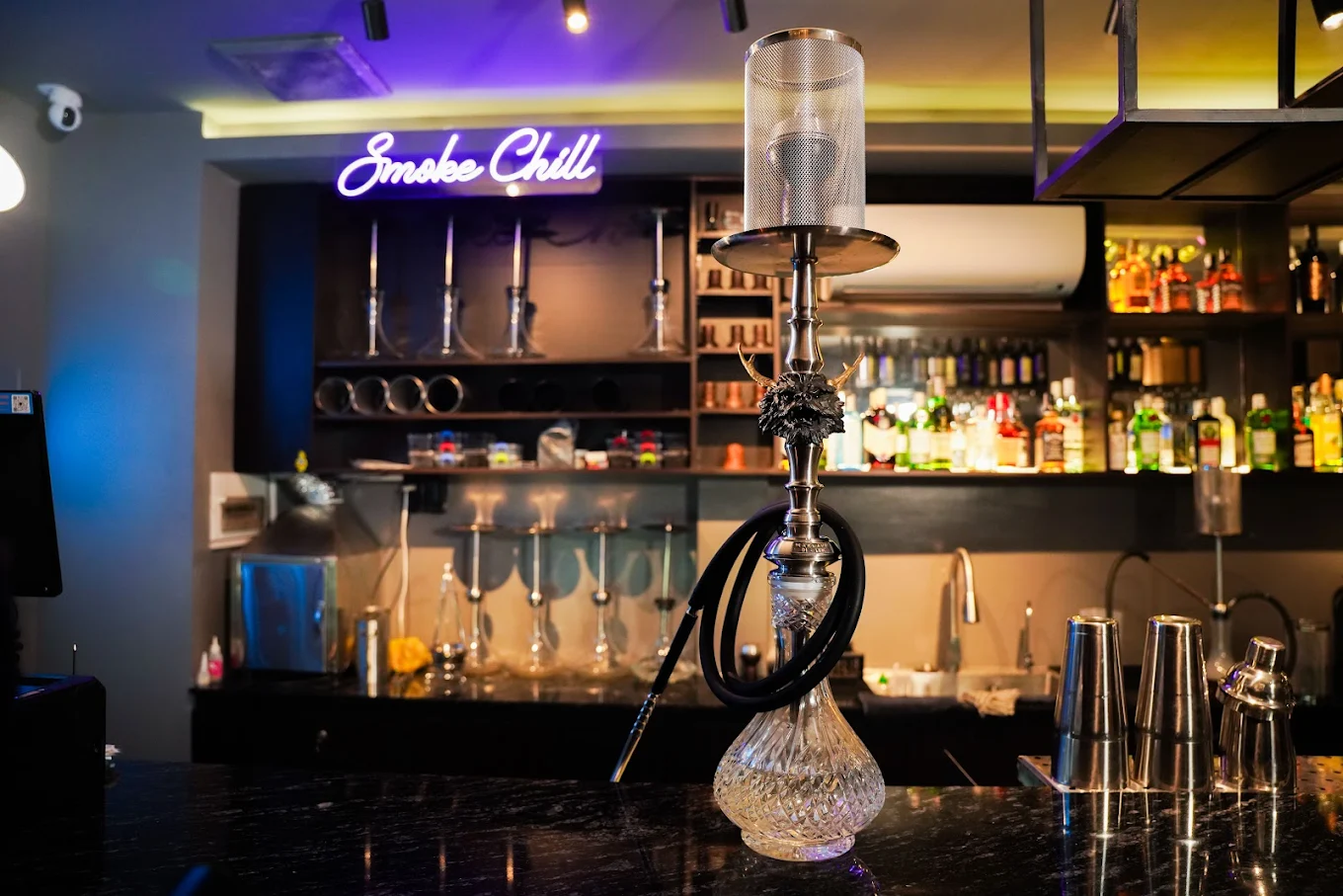 Premium hookah on the bar counter with Smoke Chill neon