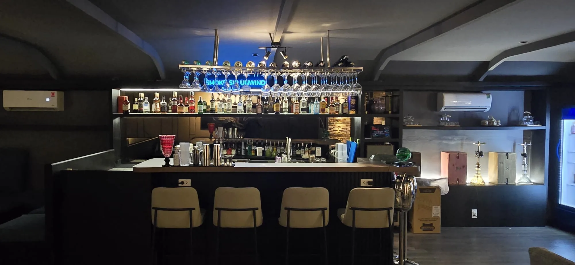 Natasha Noir Lounge bar counter with premium spirits and hookah display